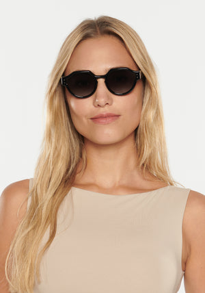 ASTOR | Black + Shadow Handcrafted, luxury black acetate KREWE sunglasses womens model | Model: Erica