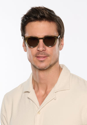 BARRETT | Marsh Polarized Handcrafted, luxury brown and green gradient acetate round KREWE polarized sunglasses mens model | Model: Tom