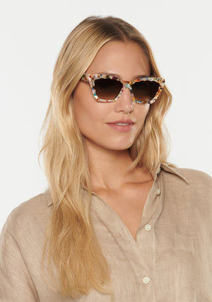 KREWE - BRIGITTE | Gelato handcrafted, luxury colorful tortoise scalloped cat eye sunglasses womens model | Model: Erica