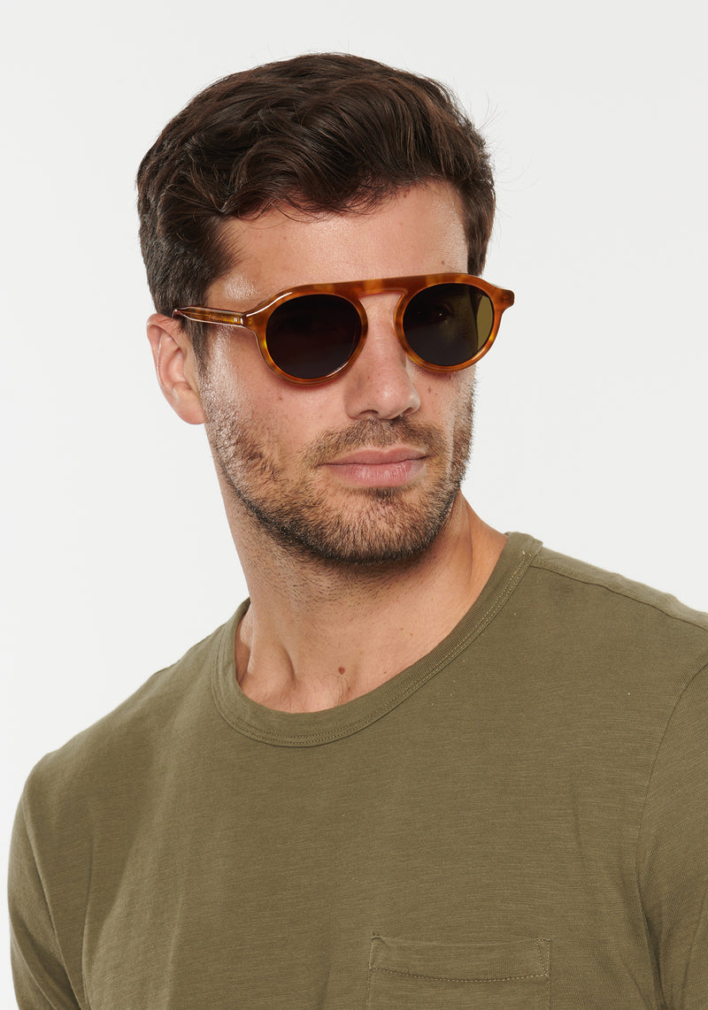 KREWE SUNGLASSES - CAMERON | Amaro handcrafted, luxury orange acetate round sunglasses mens model | Model: Douglas