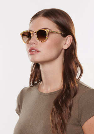 COLLINS | Frappe KREWE sunglasses handcrafted, luxury brown and green swirling round sunglasses womens model | Model: Katie