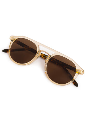 MARKLE | Champagne + Rue Tortoise 18K Polarized Handcrafted, luxury translucent tan acetate medium round KREWE polarized sunglasses with gold stainless steel metal hardware 