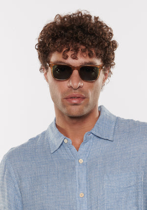 MATTHEW | Umber Polarized Handcrafted, brown tan acetate square rectangle polarized KREWE sunglasses mens model | Model: Miguel