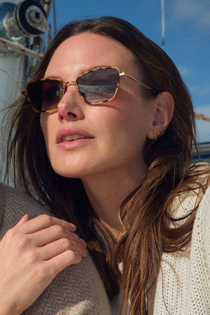 BELLA | 18K + Venezia Handcrafted, luxury brown tortoise acetate and stainless steel cat-eye KREWE sunglasses womens model campaign | Model: Emily