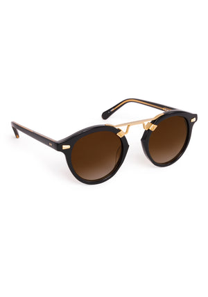 STL II | Black + Black Tea 18K Handcrafted, large round black acetate and 18K gold metal bridge KREWE sunglasses 