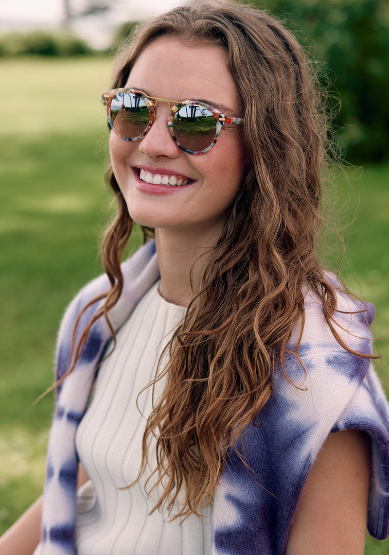 ST. LOUIS | Gelato 24K Mirrored Handcrafted, luxury, multicolored acetate mirrored round KREWE sunglasses with gold bridge and hardware womens model campaign | Model: Morgan J