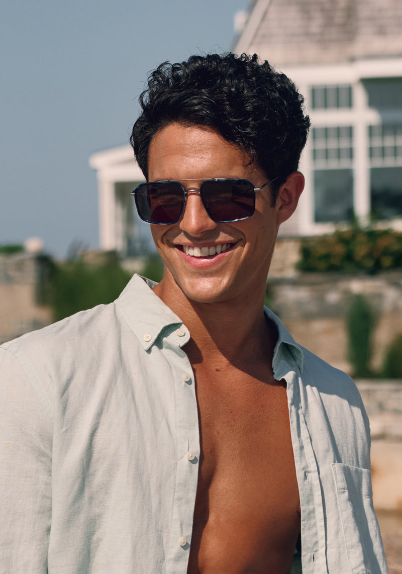 SUMMIT | Matte Raw Stainless Steel + Indigo Tortoise Handcrafted, blue indigo tortoise oversized square aviator KREWE sunglasses mens model campaign | Model: Conrado